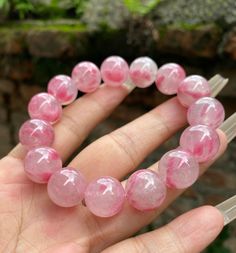 Material:pink rhodonite beads phantom quartz beads size :Approx 14mm   quantity: one strand  6mm approx 29 pcs one strands 7mm approx25 pcs one strands 8mm approx 22 pcs one strands 9mm approx 21pcs one strands 10mm approx 19 pcs one strands 11mm approx 18pcs one strands 12mm approx 16 pcs one strands 13mm approx 16 pcs one strands 14mm approx 15 pcs one strands 15mm approx 14pcs one strands 16mm approx 14 pcs one strands 17mm approx 13pcs one strands 18mm approx 13pcs one strands 19mm approx 12 Pink Crystal Bracelet With Natural Rose Quartz, Pink Rose Quartz Gemstone Bracelets, Pink Rose Quartz Crystal Bracelet With Natural Stones, Pink Crystal Bracelet Gift, Pink Round Crystal Bracelet Gift, Pink Rose Quartz Gemstone Beaded Bracelets, Handmade Pink Crystal Round Bracelet, Pink Round Beads Crystal Bracelet Spiritual, Pink Round Beads Crystal Bracelet For Spiritual