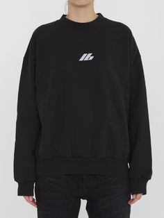 This black cotton jersey sweatshirt features a long-sleeved crewneck design, complete with both the Balenciaga Activewear logo on the front and back. It also has a ribbed collar, cuffs, and hem for a comfortable, regular fit. Size nationality: US Product number: 3304911 Product code: 697869TQVT81083 Composition: 100% cotton Black Long Sleeve Sweater With Logo Detail, Black Long Sleeve Sweater With Logo, Long Sleeve Sweater With Logo For Streetwear, Relaxed Fit Long Sleeve Sweater With Logo Detail, Relaxed Fit Long Sleeve Sweater With Logo, Fall Long Sleeve Sweatshirt With Logo Detail, Oversized Crew Neck Sweater With Logo, Oversized Crew Neck Sweater With Logo Detail, Sporty Crew Sweater With Logo Detail