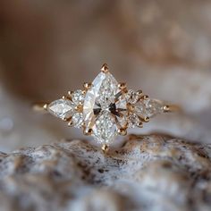 an engagement ring with three pear shaped diamonds