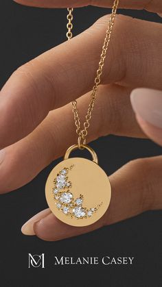 The Skyward Necklace was carefully handcrafted from solid 14k gold and depicts a crescent sweep made of ten round diamonds and three oval diamonds. ﻿The gold pendant is 19.5mm in diameter, 2mm thick and is available on its own or with a 20" rope chain that matches your choice of gold color: yellow, white, or rose. Find more images at melaniecasey.com. Celestial Style Jewelry With Brilliant Cut, Elegant Crescent Engraved Necklace, Elegant Engraved Crescent Necklace, Celestial Style Jewelry With Round Cut Diamond Accents, Celestial Jewelry With Round Cut Diamond Accents, Fine Jewelry With Moon Charm For Wedding, Luxury White Gold Moon Charm Jewelry, Luxury White Gold Jewelry With Moon Charm, Elegant Moon Charm Jewelry For Anniversary