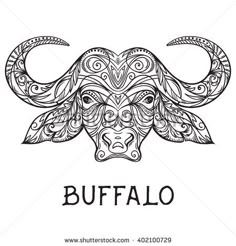 the head of a bull with patterns on it's face and lettering in black ink