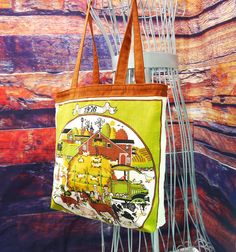 What day was your birthday on in 1976?? Now you can look it up anytime you are packing this handy dandy, fun upcycled tote!   The outside of the bag is a repurposed linen calendar towel from 1976.  It features a farm scene with everything - barns, cows, pigs, sheep and chickens. Ma and Pa and lots of kids too!  And their truck, of course. The other side of the tote is all the months of the year, so you can just look up those dates easy as can be.   The top of the tote and the straps a reddish br Vintage Upcycled Tote Bag, Retro Upcycled Bag For Everyday Use, Retro Upcycled Tote Bag, Upcycled Tote, All The Months, Plaid Purse, Vintage Calendar, Tan Purse, Wine Carrier