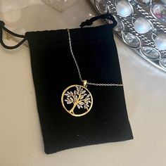 -Beautiful Crystal Tree Of Life, Pendant And Chain Is 10k Gold Over 925 Sterling Silver. -Chain Is 18” Long 10k Gold Over 925 Sterling Silver -New With Tag *** Occasion: Wedding, Engagement, Anniversary, Birthday, Mother's Day, Valentine Day, Christmas, Thanksgiving, Etc. Thank You For Checking Out My Closet Question? Leave It Below Check Out My Other Listings In My Closet As I Offer Discounts When You Bundle Like The Post For A Discounted Offer Accepting Reasonable Offers! Silver Tarnish Resistant Necklace As Gift For Mom, Silver Tarnish Resistant Necklace For Mom, Tarnish Resistant Silver Necklace For Mom, Tarnish Resistant Silver Jewelry For Anniversary Gift, Silver Tarnish-resistant Jewelry For Anniversary Gift, Heavy Chain Necklace, Crystal Tree Of Life, Large Pendant Necklace, Crystal Statement Necklace