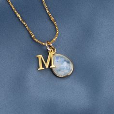 This genuine moonstone birthstone necklace symbolises happiness and self-confidence. Our 18 carat gold vermeil pendant features a real moonstone gemstone at its centre.  Our real moonstone gemstone is carefully cut in facets to show off the light-reflecting properties of the stone.  DETAILS:  * Real Moonstone gemstone. *  Crafted in 18 carat gold vermeil * Moonstone gemstone measures 13mm x 10mm. * Can be personalised with your initial charm.  * Chain: Choose from 16, 18, 20, 24 and 30 inch medi Moonstone Teardrop Necklace, Emerald Birthstone, Moonstone Earrings, Emerald Necklace, Birthstone Pendant, June Birthstone, Moonstone Necklace, Jewellery Storage, Moonstone Pendant