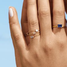 You know what they say: you can never have too many stacking rings (a gal needs options, obv). Now you can top off any stack with a created white sapphire gemstone ring in whatever shape you like: pear, baguette (bestseller!), heart (sooo qt), oval, and square. You know the drill: real, solid gold and AAA grade gems only. Pearl Ring Simple, Sapphire Gold Ring, Gold Flower Ring, Crossover Ring, Bezel Necklace, Gold Rings Stackable, Simple Pearl, White Sapphire Ring, Gold Signet Ring