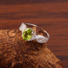 Peridot Ring, Natural Peridot Ring, Wedding Ring, Green Stone, Oval Cut Stone Ring, August Birthstone, Brides Ring, Engagement Ring Gift Her Stone Name: Natural Peridot Shape : Oval Stone Size : 6x8 MM Metal : 925 sterling silver finished with Rhodium nickel free Beautifully handcrafted as u can see in pics100% handmade more quantity available on demand We accept Custom Order If you have any questions about this piece or if we can help you with any of our other products please feel free to conta Peridot Oval Birthstone Promise Ring, Oval Peridot Birthstone Promise Ring, Oval Peridot Ring In White Gold, Peridot Birthstone Ring With Center Stone For Wedding, Oval Green Cluster Ring For Wedding, Oval Peridot Birthstone Ring For Anniversary, White Gold Peridot Rings For Wedding, Wedding Birthstone Ring In White Gold With Peridot, Oval Peridot Rings Fine Jewelry