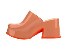 Meet Melissa Mia, a closed-toe mule that seamlessly blends traditional clog charm with a trendy and modern twist. Mia's chunky silhouette makes a bold yet casually cool statement. With an ultra-lightweight sole and Grenflex insole you'll look your best in comfort, making Mia your perfect companion for any season. Casual Orange Slip-on Mules, Modern Slip-on Clogs For Summer, Chic Slip-on Clogs With Reinforced Heel, Summer Clogs With Translucent Outsole, Modern Slip-on Clogs With Rubber Sole, Trendy Mules With Reinforced Heel, Modern Slip-on Closed Toe Clogs, Chic Slip-on Platform Mules, Chic Flat-heel Platform Mules