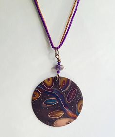 "This necklace  is made with copper and fire only!  I make it by painting patterns onto copper with a micro torch, and as the copper heats and cools it turns different colors naturally!  The copper circle 1 1/2\" and is shown on colorful silk cord.  Definitely a one of a kind piece!   These are custom made per order, so please remember - I have little control of what colors happen - your piece may not look exactly like the picture - it may be similiar, it may be more vibrant, it may be a differant color palette - but I assure you it will be cool!" Unique Hand-painted Copper Jewelry, Unique Hand Painted Copper Jewelry, Artistic Multicolor Copper Jewelry, Artsy Brown Copper Jewelry, Bohemian Hand-painted Copper Jewelry, Bohemian Hand Painted Copper Jewelry, Artsy Hand Painted Copper Jewelry, Bohemian Nickel-free Copper Wire Necklaces, Bohemian Nickel-free Necklace With Copper Wire