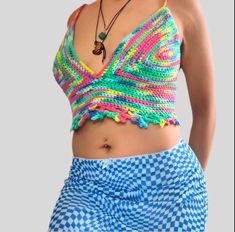 Feel the vibrant energy of the summer with our Rainbow Starr Top! This cropped top features a playful rainbow design that will make you stand out at any festival or night out. The corset backing adds a touch of sensuality, making it perfect for the end of summer. Get ready to make a statement and have some fun in this must-have top! Blue Y2k Style Crop Top For Summer, Y2k Style Blue Crop Top For Summer, Blue Y2k Style Summer Crop Top, Y2k Cropped Tank Top For Summer, Rainbow Sleeveless Top For Summer, Spring Festival Triangle Top Tank, Multicolor Fun Tops For Beach Season, Fun Multicolor Tops For Beach Season, Hippie Crop Top For Summer Music Festival