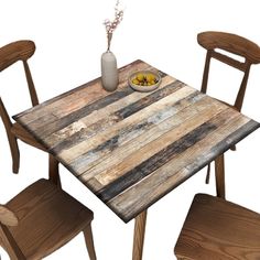 a wooden table with two chairs and a bowl of food on top of the table