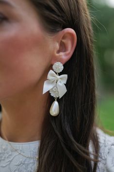 embellished mother of pearl + ivory bow – Nicola Bathie Jewelry White Clip-on Pearl Earrings For Evening, Feminine White Jewelry With Bow, White Bow Earrings For Wedding, White Bow Jewelry For Evening, White Chic Clip-on Jewelry, White Pearl Earrings With Bow For Wedding, White Formal Jewelry With Bow Detail, Formal White Bow Jewelry, Formal White Jewelry With Bow Detail