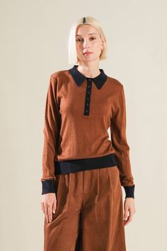 A solid sweater knit polo top with long sleeve Details: Self: 45% Nylon 28% Acrylic 18% Polyester 9% Wool Size & Fit - Model is 5`8" And Wearing Size Small- Measurements Taken From Size Small- Approx. Length: 23" Knit Tops With Collared Neckline For Fall, Brown Collared Top For Fall, Casual Fall Knit Polo Shirt, Knit Polo Sweater With Polo Collar For Winter, Brown Collared Polo Sweater For Work, Collared Black Sweatshirt For Fall, Collared Brown Polo Sweater For Work, Long Sleeve Polo Shirt For Fall, Casual Collared Polo Shirt For Fall