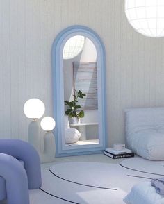 a room with white walls and blue furniture