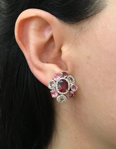 A Statement Earring handcrafted in Rose Gold Plated over Sterling Silver features a center Garnet embellished with Multi-color Spinel and Tourmaline and Halo Diamonds. A stunning, jaw-dropping stud earrings that makes a commanding statement earrings.(e-c-63) Earring measure 9mm x 20mm *LIKE* us on Facebook http://www.facebook.com/Belesas to get 10%off coupon code, *FOLLOW* us on Twitter https://twitter.com/#!/Belesas to get more exclusive coupon codes *All item are ready to ship! Free shipping o Oval Multi-stone Earrings For Wedding, Multicolor Diamond Gemstone Earrings, Oval Multicolor Earrings For Anniversary, Multicolor Oval Earrings For Anniversary, Oval Multi-stone Wedding Earrings, Elegant Pink Gemstones For Jewelry Making, Elegant Pink Earrings With Stones, Oval Multicolor Anniversary Earrings, Multicolor Gemstone Accented Earrings For Formal Occasions