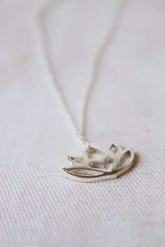 An original Lola&Cash protea necklace featuring a hidden heart -- d e t a i l s -- -protea measures 2cm wide -hand sawn out of solid sterling silver -completed in a mirror finish -includes a 45cm chain This pendant is also available in gold as seen in last picture https://www.etsy.com/listing/621948340/gold-protea-pendant-solid-9ct-yellow?ref=shop_home_active_1 -All Lola&Cash jewellery will arrive gift wrapped ---------------------------------------- Please Note - Made to order - Rush or Delicate Silver Necklace For Meditation, Spiritual Lotus Flower Necklaces For Gifts, Delicate Small Jewelry Gift, Spiritual Lotus Flower Necklace Gift, Delicate Jewelry For Gifts, Small Minimalist Necklace As A Gift, Small Minimalist Necklace Perfect For Gifts, Delicate Silver Charm Necklaces For Bridesmaids, Small Minimalist Necklace For Gift