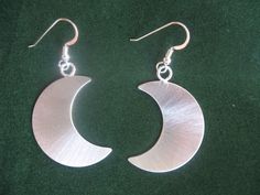 925 Crescent Moon Earrings Stevie Nicks Crescent Moons by Camias, $85.00 Celestial Half Moon Earrings With Moon Phase Detail, Celestial Half Moon Phase Earrings, Crescent Moon Charm Earrings As Gift, Celestial Crescent Moon Phase Earrings, Nickel-free Crescent Celestial Earrings, Metal Crescent Moon Phase Earrings, Silver Half Moon Earrings With Sun And Moon Design, Sterling Silver Half Moon Earrings With Moon Phase Detail, Silver Teardrop Earrings With Moon Charm