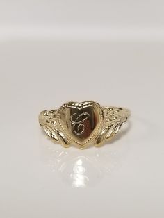 "Thanks for shopping our vintage estate store. We tend to sell well below wholesale and truly hope you enjoy all of our items. Many of the items are one of a kind, so please enjoy scrolling through the pictures and hopefully something will catch your eye. Brown spots are from camera or reflections. Estate 14k yellow gold monogram cursive capital C heart ring. Custom made ring for our shop. Ring size: 3 Setting: 7.5mm 1/4\" to 3/8\" Band width: 1.4mm Weight: .87 gram Marked 14k and it's sweet. One that you will love." C Ring, Vintage Engraved Initial Ring For Promise, Engraved Vintage Initial Ring For Promise, Classic Heart Shaped 14k Engraved Ring, Classic Engraved Heart Ring Stamped 14k, Vintage Jewelry With Initials For Promise Ring, Heirloom Engraved Heart Ring, Personalized Gold Heart Cut Rings, Personalized Gold Heart Ring For Anniversary