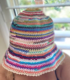 Introducing our fabulous Multi-Colored Crochet Bucket Hat, a groovy accessory that adds a touch of style to any outfit. Handcrafted with love and attention to detail, this hat is a true statement piece. Whether you're a fashion enthusiast or simply looking for a unique Mother's Day gift, this hat is the perfect choice. Featuring a delightful blend of vibrant colors, this hat exudes a playful and eye-catching appeal. The intricate crochet work showcases the craftsmanship and dedication that goes Multicolor One Size Cotton Yarn Hat, Multicolor Cotton Yarn Hat, One Size, Bohemian Multicolor Cotton Yarn Sun Hat, Multicolor Brimmed Cotton Yarn Hat, Multicolor Knitted Cotton Yarn Hat, Trendy Festival Bucket Hat One Size, Multicolor Cotton Yarn Hat With Curved Brim, Multicolor Brimmed Mini Hats In Yarn, Retro Multicolor Summer Hats