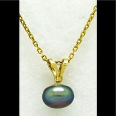 Metal Purity 14k Condition New With Tag Gemstone 1 Genuine Tahitian Pearl - 6.5 Mm Aaa . . . Quality Grade Color . . . Eggplant Luster . . . Good Dimensions 6.5 Mm Pearl Measurements 10 Mm (0.39") High Bail Included Shape Round (Sphere) Free Silver Chain 18" (Gold Finish) Formal Tahitian Pearl Necklace In Yellow Gold, Formal Yellow Gold Tahitian Pearl Necklace, Anniversary Tahitian Pearl Necklace In Yellow Gold, Oval Tahitian Pearl Jewelry For Gift, Yellow Gold Oval Pearl Necklace, Oval Yellow Gold Pearl Necklace, Tahitian Pearl Pendant, Wedding Earrings Studs, Jade Bead Necklace