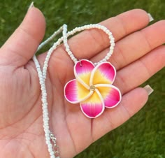 Here are some gorgeous necklaces newly available from Hawaii! The matching earrings are included as a set! These are beautifully made white beaded necklaces with a flower pendant that also has a diamond in the middle! They come in pink or purple! Makes for a beautiful gift for both adults,  kids, and anyone who wants to bring home a little aloha! 🌺 Cheap Handmade Summer Flower Necklace, Cheap Summer Flower Necklace Gift, Moana Necklace With Removable Heart Of Te Fiti, Cheap Handmade Flower Necklace For Beach, Cheap Adjustable Flower Necklace For Beach, Cheap Flower-shaped Bracelets For Vacation, Affordable Adjustable Flower Necklace For Beach, Cheap Flower Charm Necklace For The Beach, Plumeria Flower Necklace