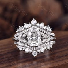 a diamond ring on top of a wooden table