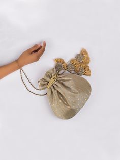 Deep Grey Chandani Potli Bag By Vareli Bafna now available at Trendroots Gold Potli Bag With Tassels For Party, Festive Gold Potli Bag With Tassels, Festive Celebration Bags With Tassels, Festive Gold Bag With Tassels, Festive Party Bags With Tassels, Elegant Festive Tassel Bags, Elegant Festive Bags With Tassels, Festival Potli Bag With Tassels For Party, Festive Elegant Potli Bag With Tassels