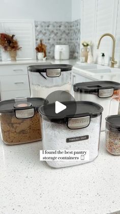 the kitchen counter has four containers with food in them