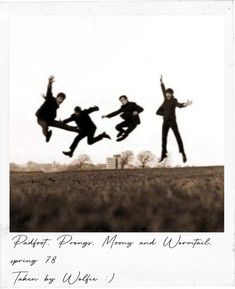 three people jumping in the air with their arms outstretched