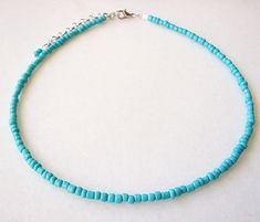 Turquoise Beaded Choker, Seed Bead Necklace Dainty and elegant all turquoise beaded choker with glass tiny seed beads. Shown with the white choker necklace. DESCRIPTION Made from 2mm glass seed beads and closes with a gold plated clasp and 2 inches adjustable chain. SIZE Necklace is 13 inches and can be adjusted up to 15 inches with a 2 inches extender chain. Please let me know if you would like a different length. WRAPPING - All ZafireniaDainty jewelry arrive gift wrapped in a cute bag or box r Blue Turquoise Necklace With Spacer Beads As Gift, Blue Turquoise Necklace With Tiny Beads For Jewelry Making, Adjustable Blue Turquoise Necklace With Spacer Beads, Blue Beaded Turquoise Necklace With Round Beads, Blue Turquoise Necklace With Spacer Beads, Turquoise Necklace With Spacer And Round Beads, Blue Turquoise Necklace With Polished Beads For Beach, Beach Turquoise Necklace With Polished Beads, Turquoise Seed Bead Necklace