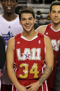 three basketball players standing next to each other