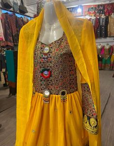 This beautiful traditional Afghan/Pashtoon dress is handmade in Swat valley. Featuring beautiful Swati Hand embroidery and a fine quality fabric These new design frocks are used as wedding dress , party wear, For Nikah and Engagement/Mangni and Mehndi night events. The dress measurements are kept average.  Our dresses are available in variety of different colors and comprise three essential pieces: 1: Qamees (Shirt) 2: Shalwar (Pants/Trouser) 3: Dupatta (Shawl) Navratri Dress With Embroidered Border, Transitional Yellow Dress With Resham Embroidery, Bohemian Chanderi Festive Dresses, Bohemian Chanderi Dresses For Eid, Bohemian Chanderi Dress For Festive Occasions, Bohemian Chanderi Dress With Dabka Work, Bohemian Chanderi Dress For Festive Season, Bohemian Chanderi Embroidered Dress For Festive, Festive Bohemian Chanderi Dress