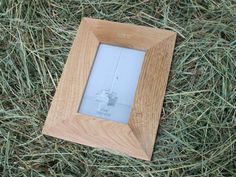 a wooden frame sitting on top of grass