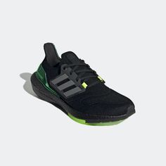 the adidas running shoe in black and green is on sale for $ 99, originally