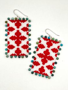 Hand beaded red and white earrings with turquoise details Turquoise Earrings With Large Beads For Gifts, Handmade Artisan Red Earrings, Unique Handwoven Red Jewelry, Traditional White Beaded Earrings For Gift, Artisan White Beaded Earrings With Dangling Beads, Artisan Red Handmade Beaded Earrings, Handmade White Beaded Rectangular Earrings, White Handwoven Dangle Beaded Earrings, White Handwoven Beaded Dangle Earrings