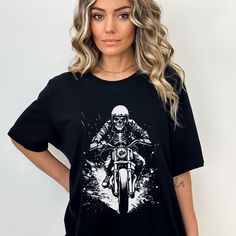 Skeleton Motorcycle Rider T-Shirt, Skeleton Rider Tee, Halloween Biker Tee, Ghost Rider Shirt, Motorcycle Shirt.  Unisex T-Shirt.  Women's Shirt, Men's Shirt,  Get ready to ride in style and showcase your passion for adventure with our skeleton motorcycle t-shirt! 🖤 To make this shirt your own, add to cart today! MATERIALS: We chose the Bella+Canvas brand for our shirts because they are 100% sweatshop free and they are eco-friendly. Bella+ Canvas shirts are made from high-quality cotton. This s Skeleton Motorcycle, Motorcycle Tshirts, Motorcycle Riders, Ghost Rider, Bella Canvas, Unisex T Shirt, Looks Great, Everyday Wear, Womens Shirts