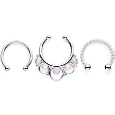 Pink Faux Opal Twisted Horseshoe Clip On Septum Set Expand your septum jewelry collection with this set of three unique septum rings! This set features two 16 gauge horseshoe barbell rings, one with a twisted design, and one clip on circular ring. All three are 3/8" and made with durable 316L surgical grade stainless steel. The clip on circular ring comes complete with an iridescent pink faux opal for that extra big of bling! Sold as a set of three.Specifications16 Gauge (1.2mm), 3/8" (10mm), 31 Opal Body Jewelry, Septum Nose, Circular Barbell, Tongue Rings, Septum Jewelry, Belly Rings, Opal Rings, Septum Ring, Body Jewelry