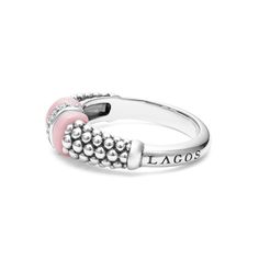 Diamonds set in sterling silver are accented by a pop of pink ceramic and Caviar beading on this every day ring. LAGOS diamonds are the highest quality natural stones. Luxury Pink Sterling Silver Rings, Luxury Pink Sterling Silver Diamond Ring, Luxury Pink Diamond Ring In Sterling Silver, Elegant Pink Enamel Ring, Pink Enamel Ring Fine Jewelry, Pink Sterling Silver Rings With Stones, Elegant Pink Stackable Rings With Accent Stones, Elegant Pink Sterling Silver Stackable Rings, Pink Enamel Ring Fine Jewelry For Anniversary