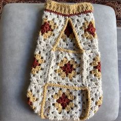 a crocheted bag sitting on top of a chair