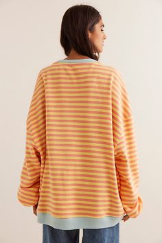 So cool and classic, this timeless crewneck is featured in an oversized, slouchy silhouette and staple striped print with contrasting hems for added dimension. **Fit:** Relaxed, oversized fit **Features:** Crew neckline, dropped shoulders, contrast hems **Why We | Classic Striped Oversized Crewneck by We The Free at Free People in Orange, Size: L Oversized Retro Sweatshirt, Relaxed Fit Crew Neck Top With Striped Cuffs, Oversized Top With Striped Hem, Oversized Tops With Striped Hem For Spring, Oversized Spring Top With Striped Hem, Oversized Striped Hem Tops For Spring, Spring Oversized Top With Striped Hem, Oversized Tops With Striped Collar For Fall, Crew Neck Tops With Striped Hem