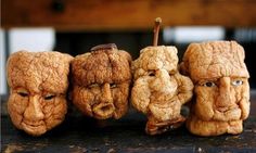 three faces made out of bread sitting next to each other