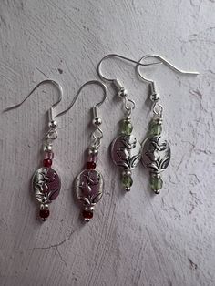 These wire earrings have a silver bead, which has a butterfly and a tulip. It is accented by seed beads the beads come in different accent colors. Please specify which color you would like. Silver Flower Beaded Earrings As Gift, Silver Flower Beaded Earrings For Gift, Diy Beaded Earrings, Tulip Earrings, Jewelry Accessories Ideas, Funky Jewelry, Jewelry Lookbook, Drop Beads, Silver Bead