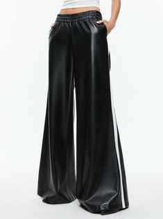 Our best-selling wide leg pant is now crafted in soft vegan leather that looks just like the real thing. Elba includes a low rise, full length leg, elastic waistband (you're welcome) and racing stripe up the side. Such a cool pant. Youre Welcome, Low Rise Pants, Racer Jacket, Leather Pant, Long Tank, Racing Stripes, Wide Leg Pant, Elba, Side Stripe