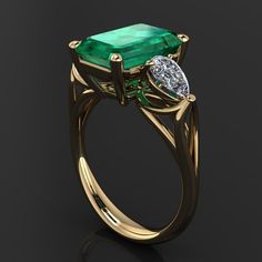 This is sooo fun! Our version of the stunning emerald ring worn in the movie Crazy Rich Asians. With a big delicious 4 carat green emerald cut ZAYA moissanite center, flanked by a pair of colorless pear shaped moissanite. Shown in 14k yellow gold, but also available in 14k white gold, 14k rose gold, or platinum. [[----- GEMSTONE DETAILS -----]] One 4 carat, 11.5x7.5mm green emerald cut ZAYA moissanite, available exclusively from J Hollywood Designs. Includes gem certification/lifetime warranty. Emerald Cut Moissanite Promise Ring, Diamond Ring With Accent Stones For Proposal, Green Moissanite Diamond Ring With Vvs Clarity, Green Diamond Ring With Radiant Cut And Prong Setting, Emerald Cut Green Diamond Ring With Prong Setting, Emerald Ring With Prong Setting And Radiant Cut, Gift Emerald Moissanite Ring With Asscher Cut, Green Diamond Ring With Vvs Clarity And Radiant Cut, Emerald Cut Moissanite Diamond Ring