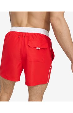 Soak up the sun in these recycled-fiber swim trunks built with quick-drying properties and UPF 40+ sun protection. 5" inseam (size Medium) Elastic/drawstring waist Front slant pockets; back patch pocket Lined 100% REPREVE polyester REPREVE recycled polyester is made from 100% post-consumer recycled plastic bottles Machine wash, tumble dry Imported Functional Nylon Swimwear For The Beach, Functional Swimwear With Elastic Waistband For Swimming, Functional Moisture-wicking Swimwear For Beach, Sporty Red Short-length Swimwear, Functional Beach Bottoms For Summer, Functional Beach Shorts For Summer, Functional Summer Beach Shorts, Sporty Red Swim Trunks, Nylon Swim Trunks For Beach In Warm Weather