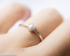 14K White Gold Engagement Ring... Minimalist & simple engagement ring with a pear shaped diamond ♡ ► FEATURES; ❥Pearl: 3mm round fresh water pearl (Color G; clarity VS) ❥Material Options: 14k Rose Gold, 14k Yellow Gold, 14k White Gold ❥Size: ALL RING SIZES ARE AVAILABLE ► HOW TO ORDER; Please select your preffered material and size from the menu while adding to card. ► PROCESSING & SHIPPING ❥We ship to worlwide, please check current delivery times depending on your location at the bottom Minimalist Pearl Ring With Single Diamond, Minimalist White Gold Pearl Ring, Minimalist Teardrop Stackable Rings As Gift, Minimalist White Solitaire Stackable Rings, Gold Pearl Engagement Ring, Simple Pearl Ring, Pearl Ring Simple, Engagement Ring Simple, Pear Diamond Ring