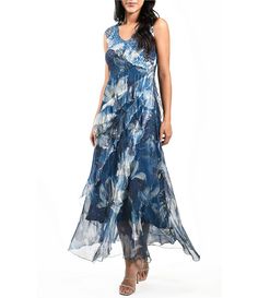 Komarov Sleeveless Ruffled V-Neck Chiffon Maxi Dress | Dillard's Elegant Sleeveless Chiffon Georgette Dress, Elegant Sleeveless Chiffon Dress, Elegant Sleeveless Georgette Dress, Fitted Sleeveless Silk Chiffon Dress, Sleeveless Georgette Dress With Ruffles, Blue Sleeveless Silk Chiffon Dress, Summer V-neck Chiffon Dress With Pleated Bodice, Sleeveless Silk Chiffon Dress For Summer, Chiffon Sleeveless V-neck Dress With Ruffles