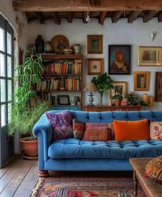 a living room filled with furniture and lots of books