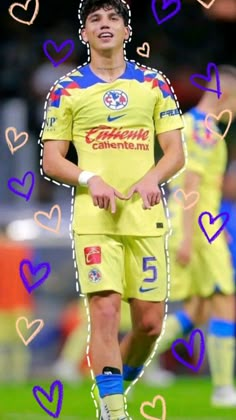 an image of a soccer player with hearts on his face and in the background he is wearing a yellow uniform