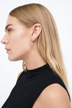 Modernism and minimalism collide in our Venus Drop Earrings. With a sleek profile and a reflective finish reminiscent of brilliant city lights, these sterling silver drop earrings are handcrafted to make your style shine day after day, night after night, season after season. Each pair includes a Marcella-branded vegan leather travel case for safe storage and easy travel.[SPLIT] Available in one size. Approximately .75” (2 cm) long. 18KT yellow gold plated brass. In silver, rhodium plated brass. Minimalist Earrings With Shiny Finish For Formal Events, Minimalist Earrings With Shiny Finish For Formal Occasions, Minimalist Formal Earrings With Shiny Finish, Modern Linear Earrings For Everyday Wear, Minimalist Long Drop Teardrop Earrings, Modern Teardrop Wrap Earring (single), Minimalist Single Teardrop Earring For Formal Wear, Modern Teardrop Wrap Earring, Minimalist Single Teardrop Earring For Formal Occasions