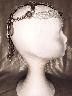 Stunning vintage old gold and super sparkling rhinestones headdress. This headpiece has a central piece all covered in strass and sparkling white rhinestones combined with antique afgan pieces that gives the whole piece an awesome movement and elegant look. On the back, a flower shaped rhinestones, and an old kuchi piece will make your look the most incredible and sparkling in the room. One of my favorites, makes anyone look like an incredible vedette from the 20'. One of a kind, our headpieces Adjustable Teardrop Crown Headpiece For Party, Adjustable Teardrop Crown Headpiece For Festivals, Adjustable Tall Crown Headpieces For Festivals, Adjustable Festival Headpiece With Rhinestones, Adjustable Rhinestone Festival Headpiece, Adjustable Rhinestone Headpiece For Festival, Adjustable Crown Headpiece For Festivals, Adjustable Crown Headpieces For Festival, Vintage Gold Headpiece For Evening